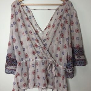 Shear floral top faux wrap around